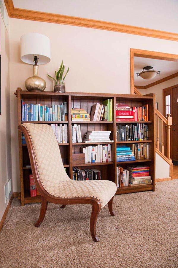 slipper chair in front of large mission stickley bookcase