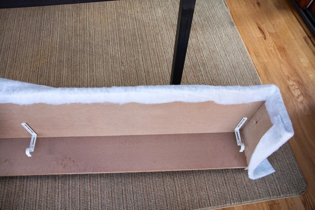 cornice box wrapped with batting on floor