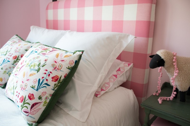 DIY Upholstered Headboard made out of pink buffalo check fabric 