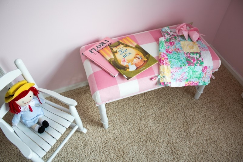 make this pink and white upholstered bench by following how to upholster a bench instructions by DIY Decor Mom