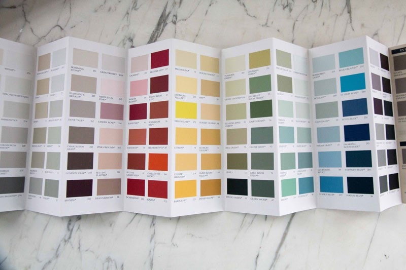 paint chips on marble background- how to pick out paint colors