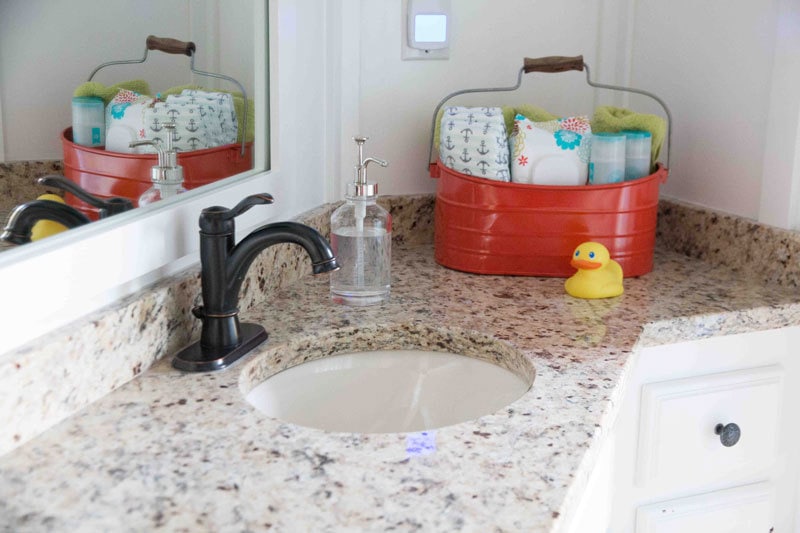 granite counter white painted bathroom cabinets