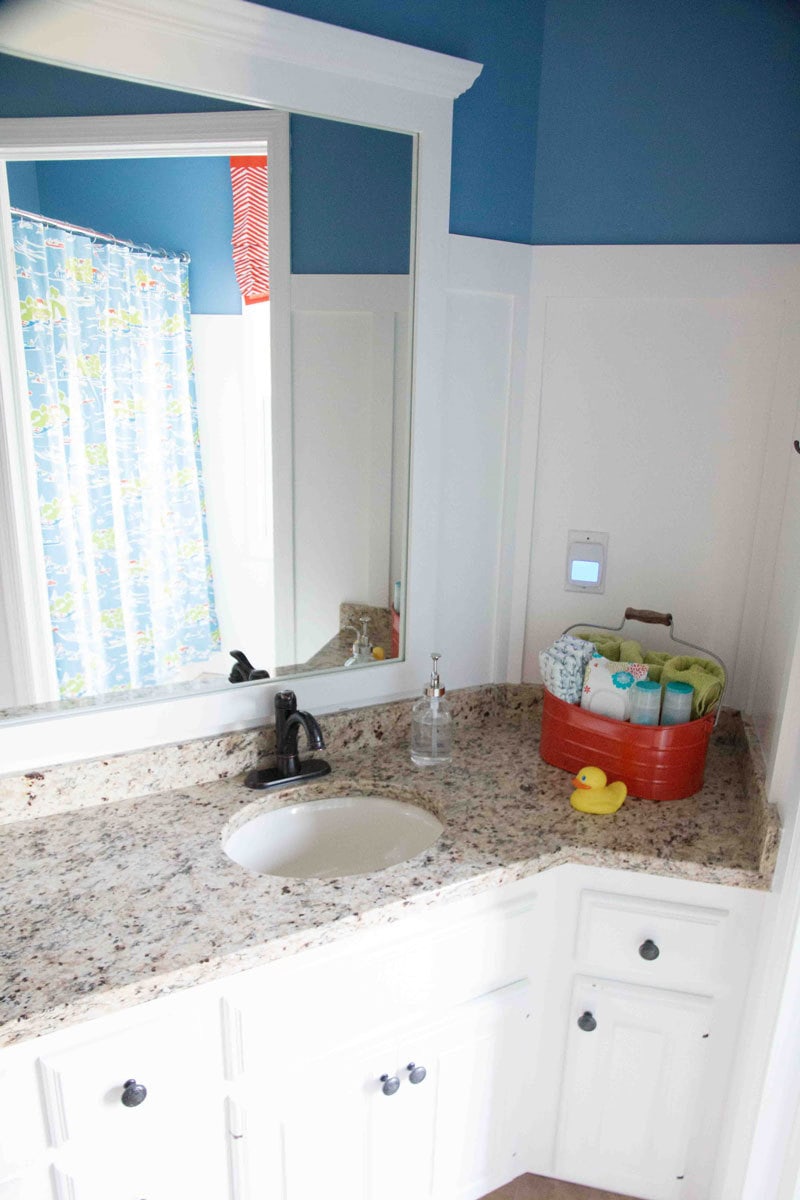 white painted bathroom cabinets and white painted bathroom vanity with granite countertops and oil rubbed bronze hardware