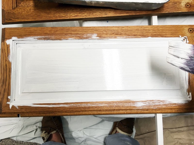 bathroom cabinets being painted white with primer