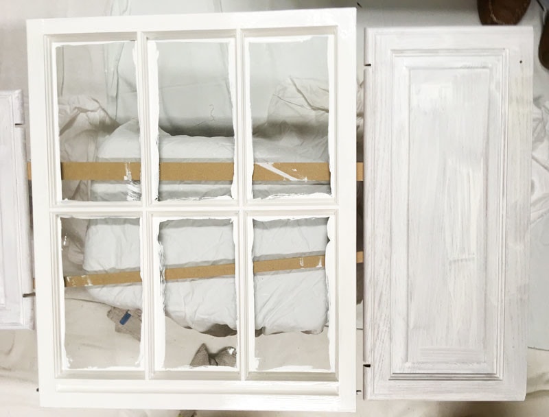 bathroom cabinets painted white--two coats of primer and two coats of paint