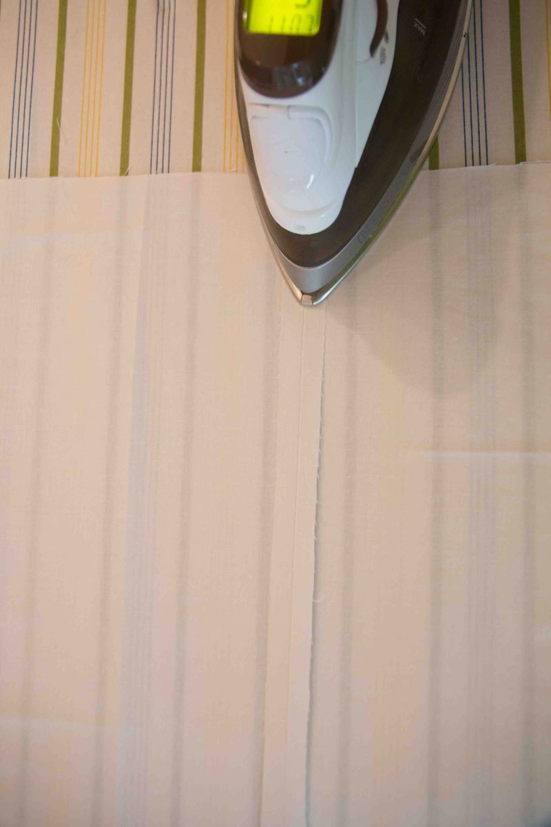 ironing fabric liner for DIY Roman Shades--how to make roman shades tutorial