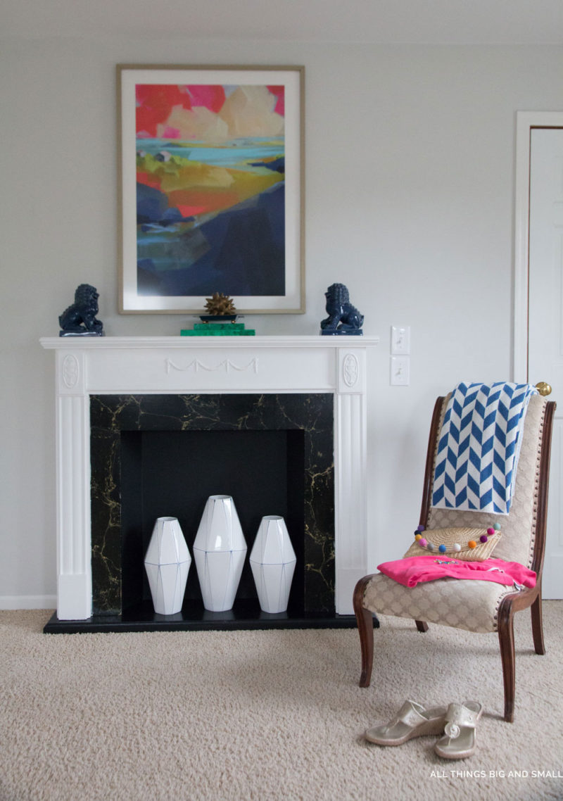 benjamin moore classic gray walls and Simply White fireplace with chair in bedroom