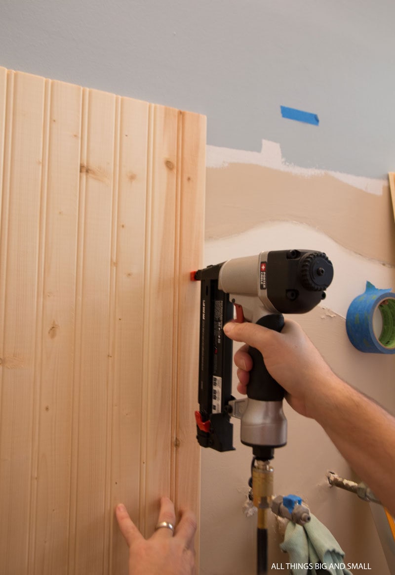 use a nail gun to hold the boards in place while the liquid nails work to adhere to bathroom walls for beadboard bathroom