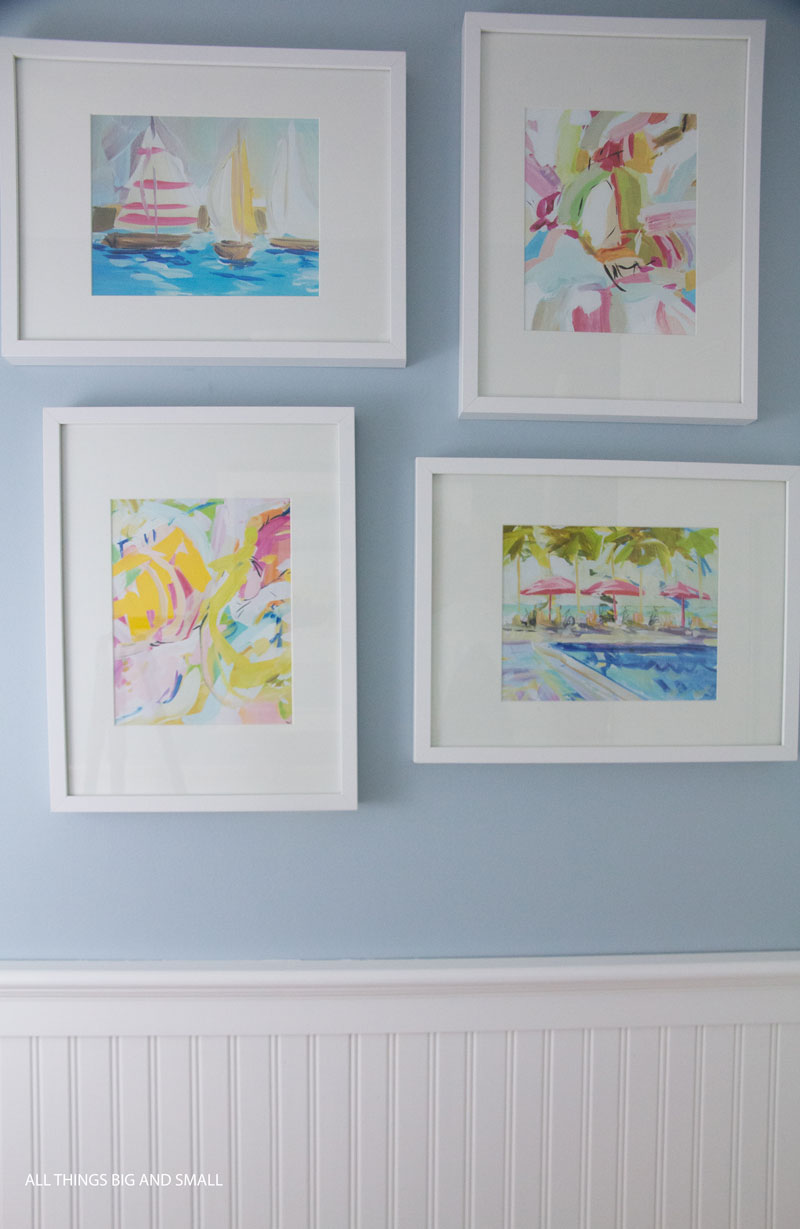 art above beadboard walls in bathroom--see how to install beadboard in this easy tutorial