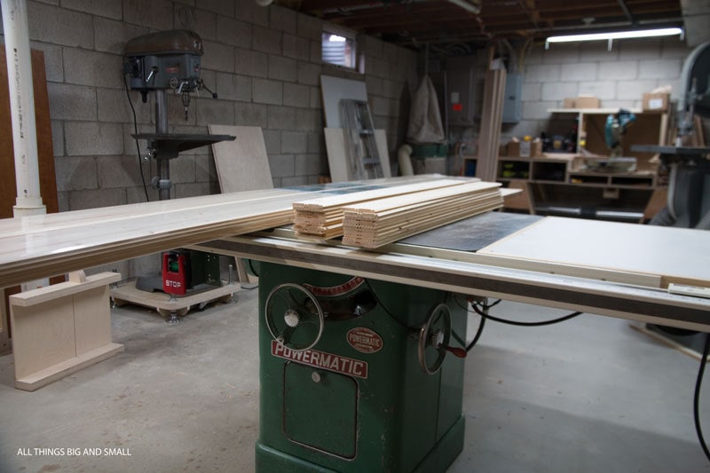 basement workshop with beadboard planks ready to be installed