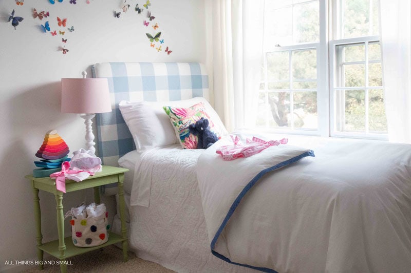 The cutest blue buffalo check DIY headboard! Such a cute nursery!