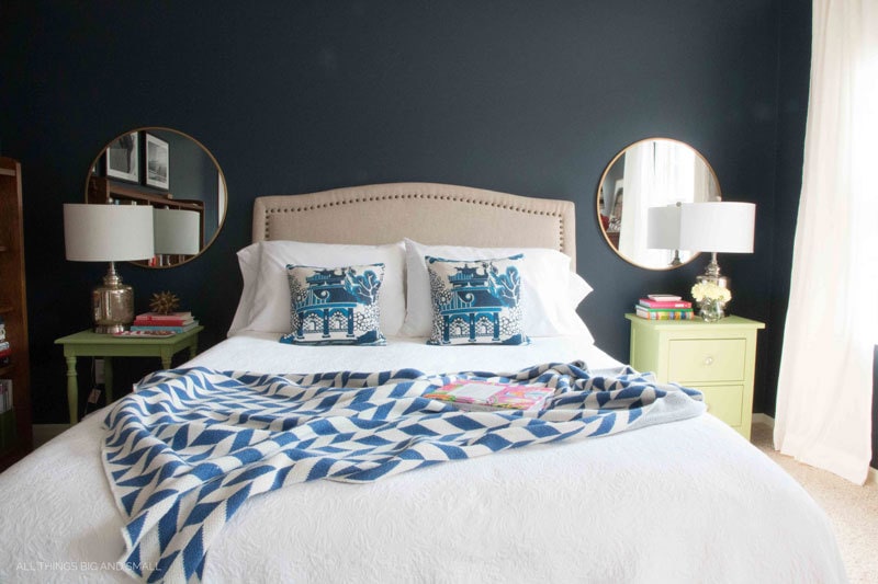 navy blue bedroom with hale navy walls and blue and white bedding