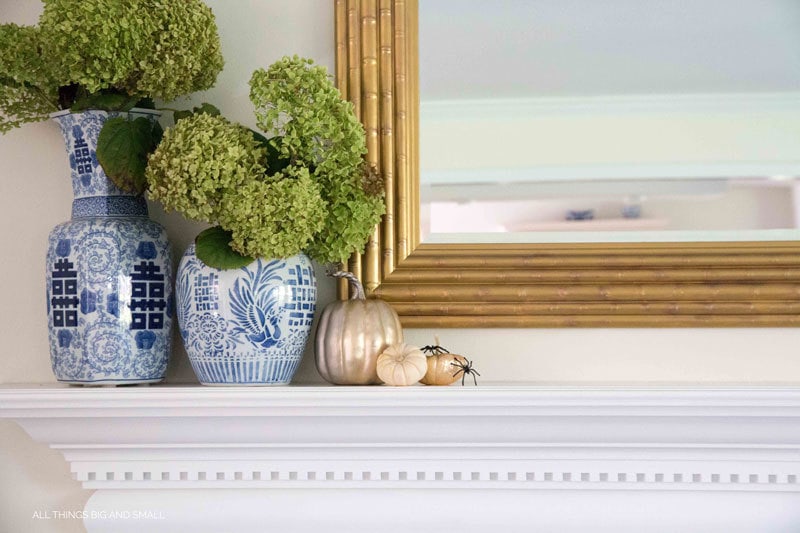 love this gold and blue and white mantel for fall