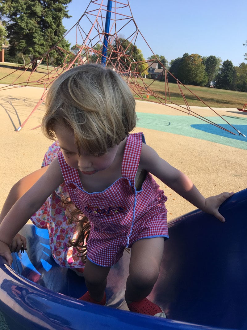 toddler climbing slide at park- summer schedules for kids that work