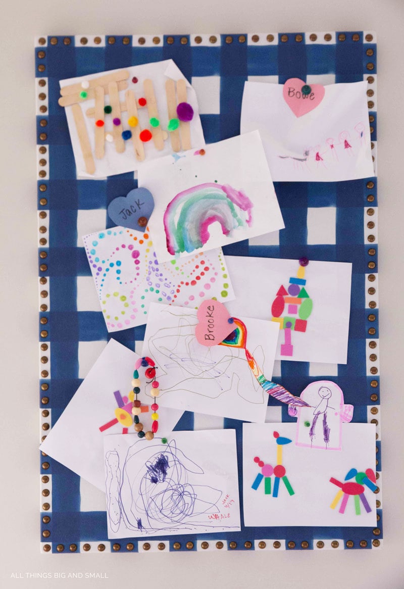 blue buffalo check DIY bulletin board with kids art in playroom decor makeover