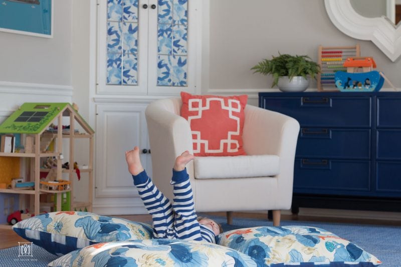 kid bouncing on diy floor pillow and giant floor cushions