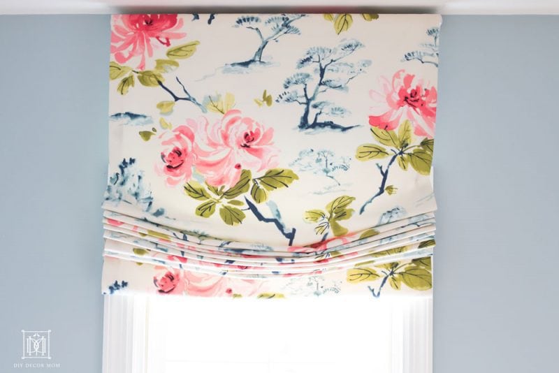 pink blue and white chinoiserie roman shade fabric in blue and white bathroom