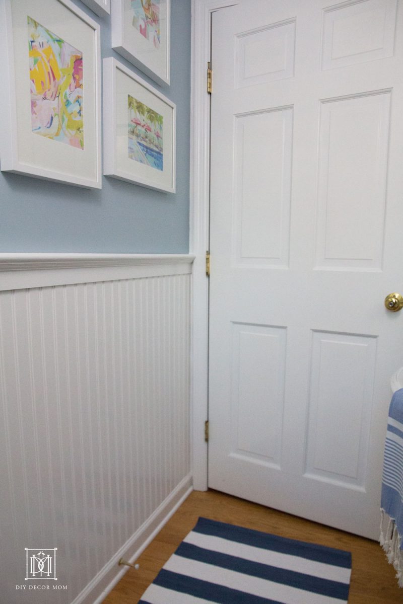 blue and white bathroom with white beadboard blue walls