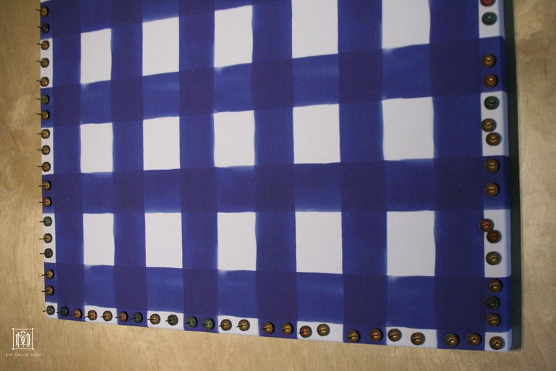 fabric covered bulletin board with nailhead trim