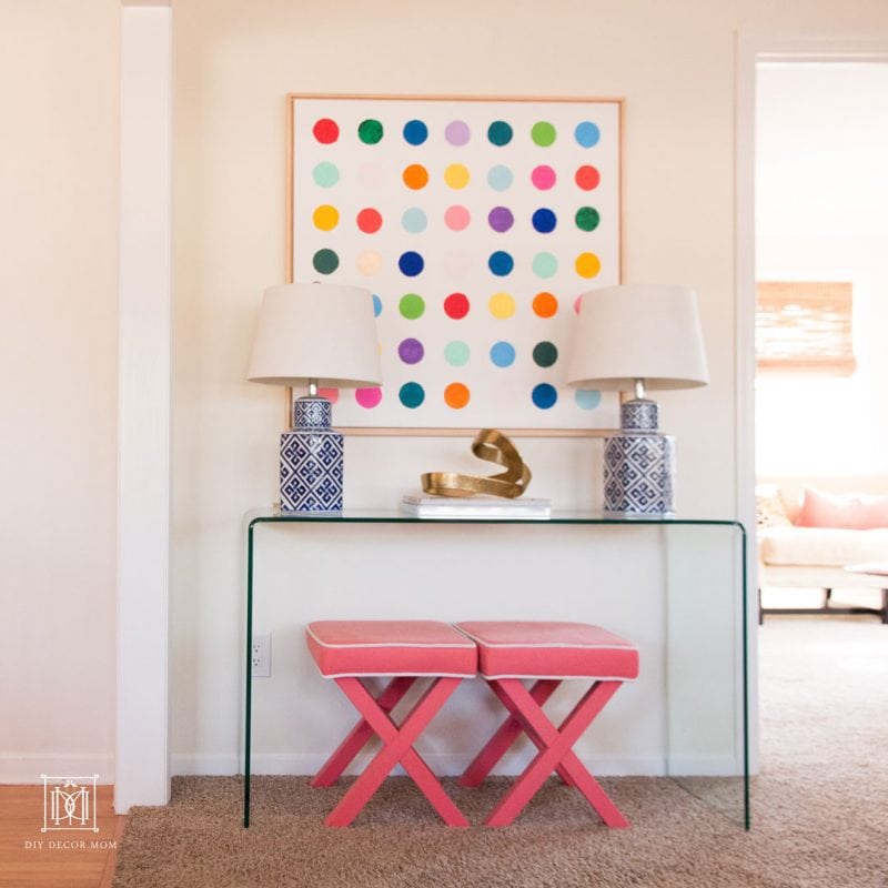 glass console table with pink stools abstract art and pink stools | console table decor