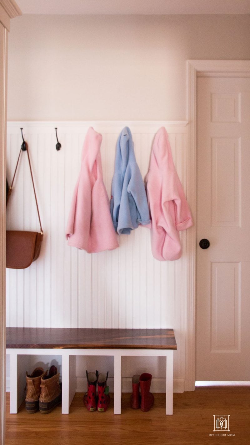 small entrance mudroom in narrow hallway with coat hooks beadboard and mudroom bench diy