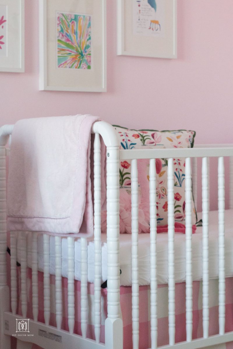 little girls shared bedroom with crib