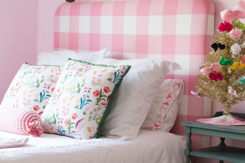 shared girls bedroom double bed with upholstered pink buffalo check DIY headboard