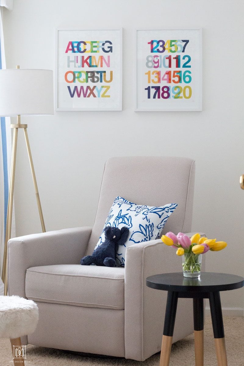 baby boy nursery decor ideas- whites and navy accents with rocking chair