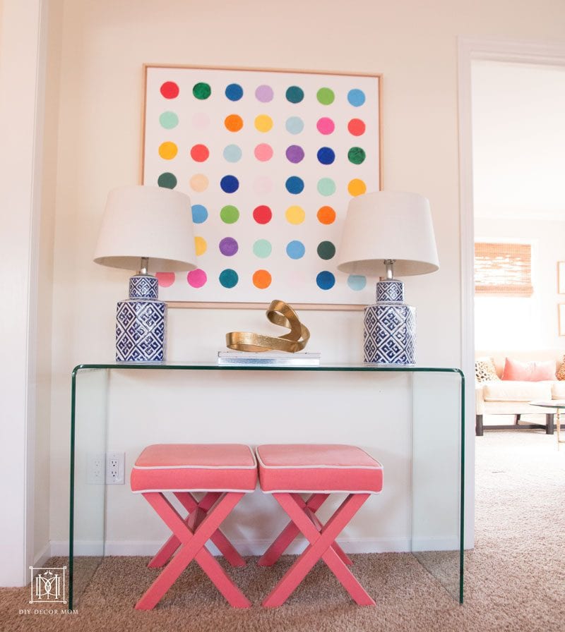 SUCH cute modern diy wall art in living room! white large canvas with wood frame and multicolored polka dots