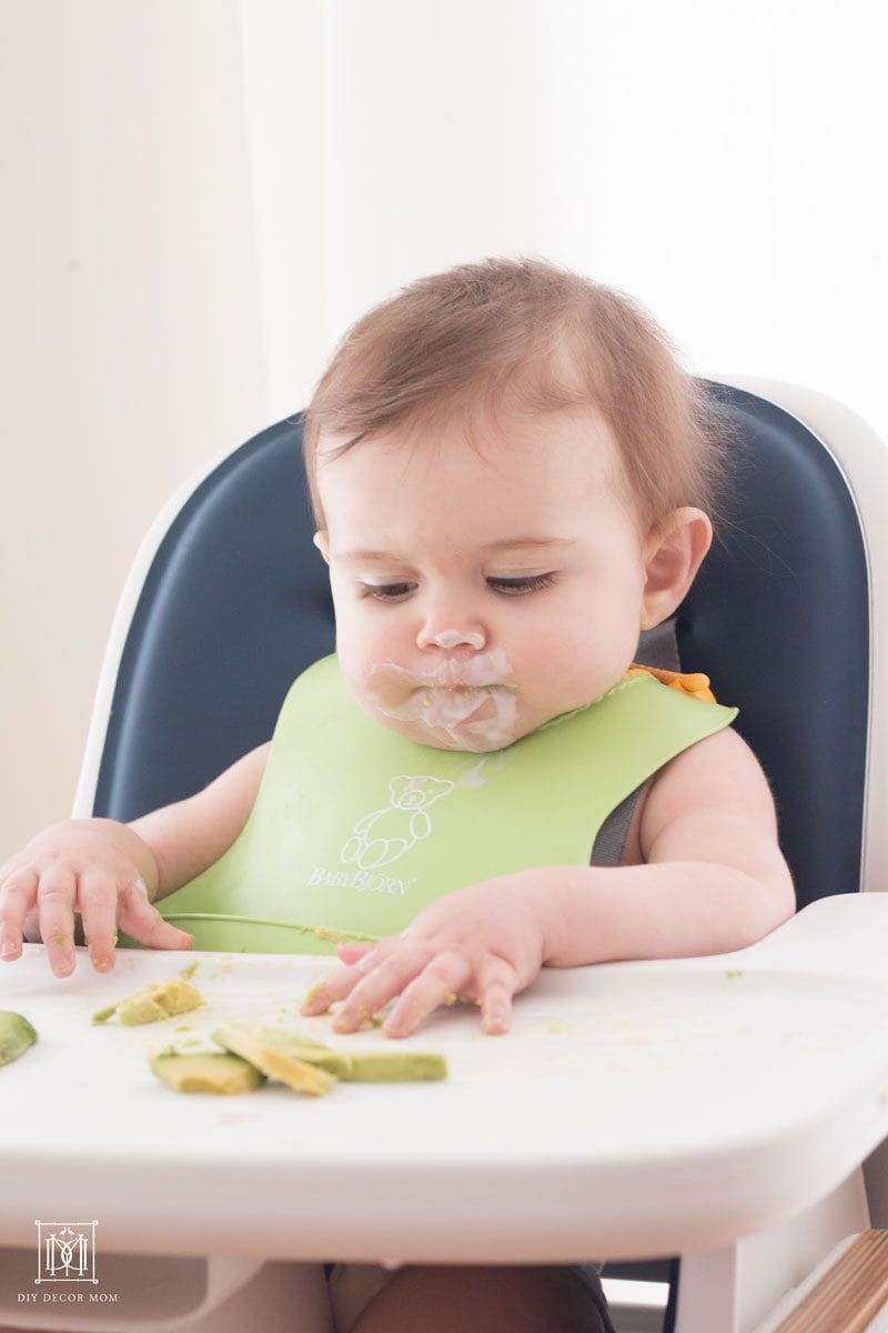 messy baby with yogurt and avocadoes what to look for in easy to clean high chair