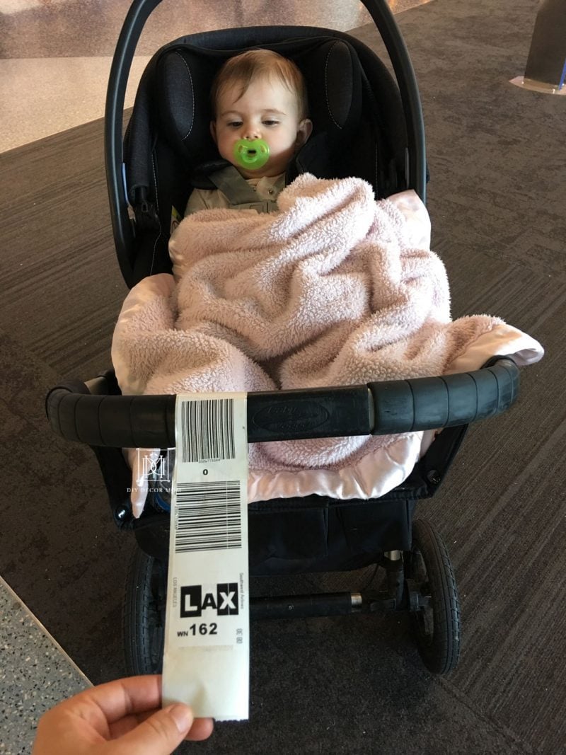 traveling with baby--picture of stroller with luggage tags