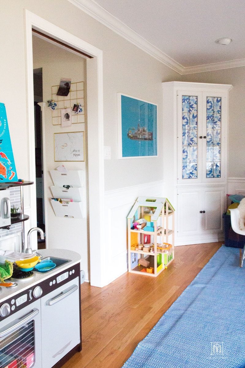 playroom with family command center with file folders white board and idea board on wall