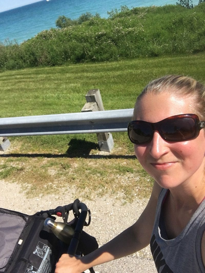 mom running with double jogging stroller