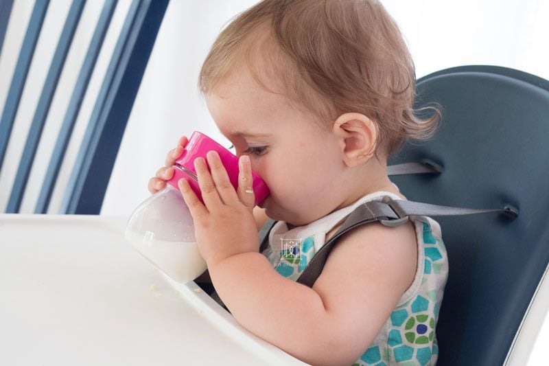 baby girl drinking sippy cup baby led weaning style