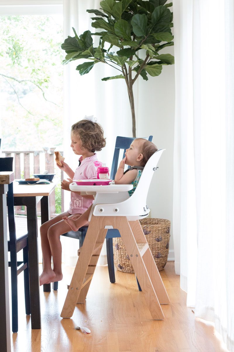 baby and girl baby eating at kitchen table baby led weaning style