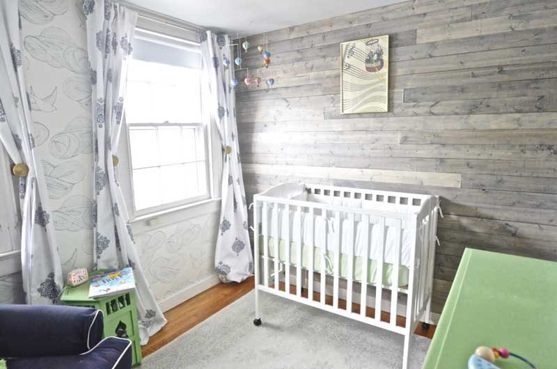 gender neutral nursery with pallet accent wall from At Charlotte's House- great boy nursery themes