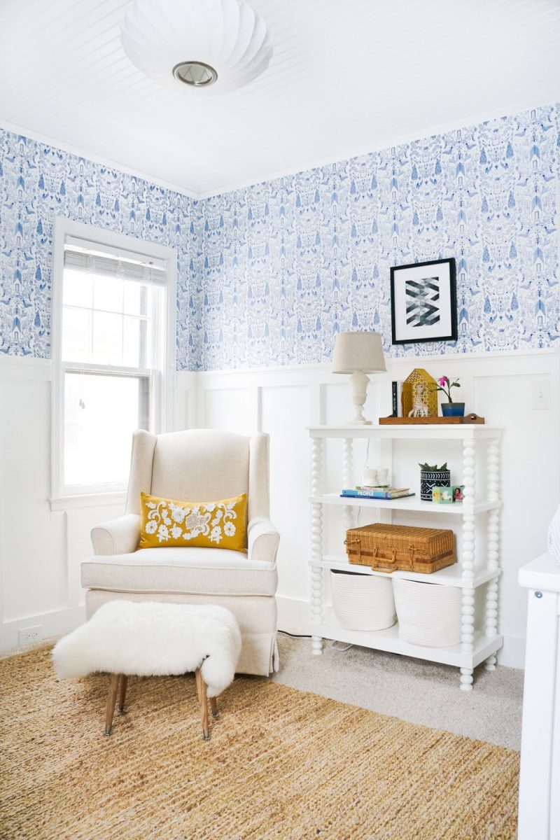 boy nursery ideas from Francois et Moi- board and batten in nursery with blue wallpaper and white rocking chair