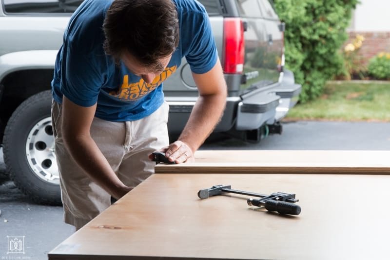 cutting a piece of plywood for diy console table