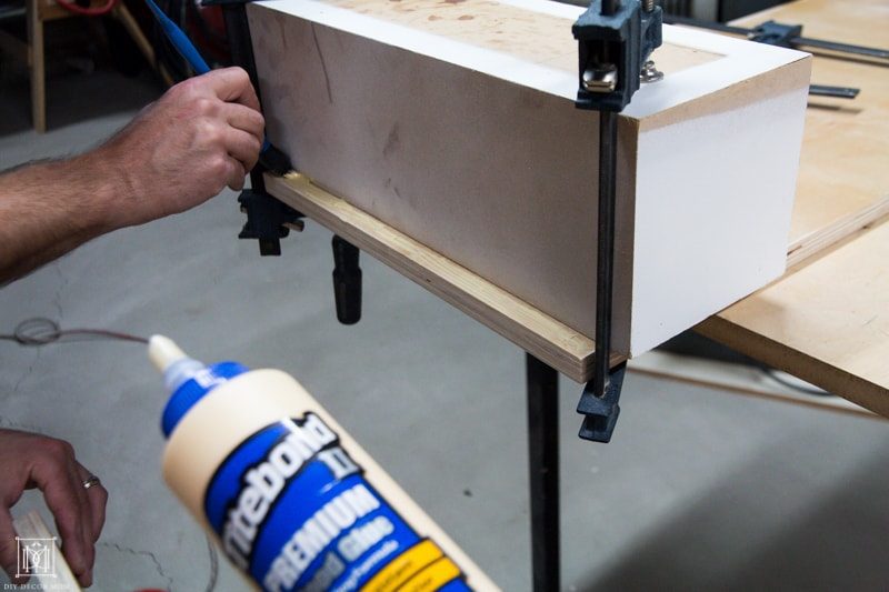 how to make a diy console table- gluing plywood together