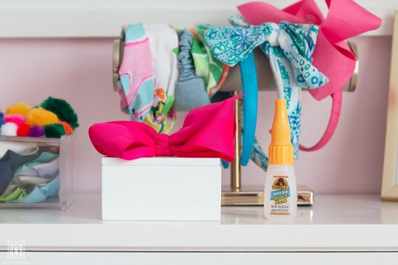 diy ponytail holder white box on a bookcase in girls bedroom