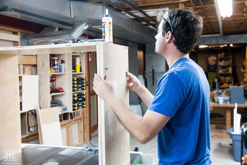 securing two pieces of plywood together to make a diy console table