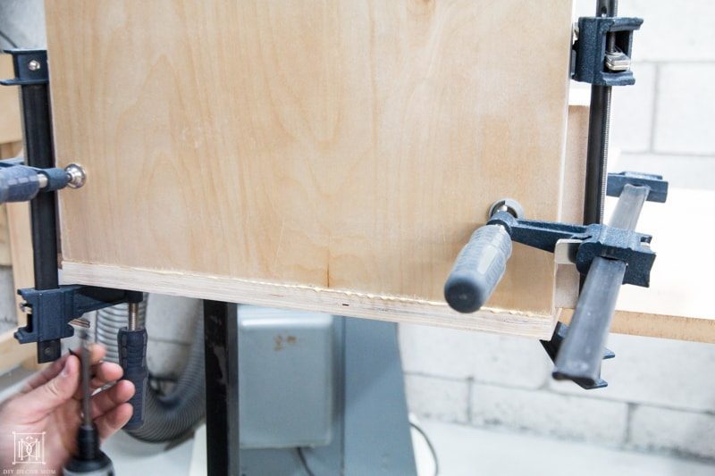 use clamps to hold glue plywood diy console table