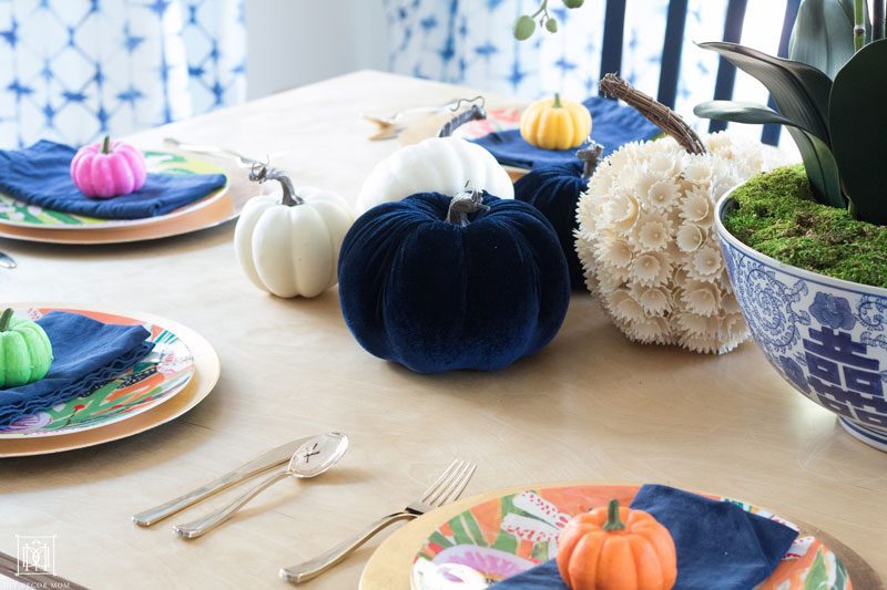 colorful pumpkin fall tablescape with blue and white fall decor ideas