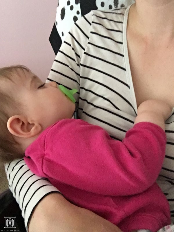 breastfeeding mom nursing baby to sleep