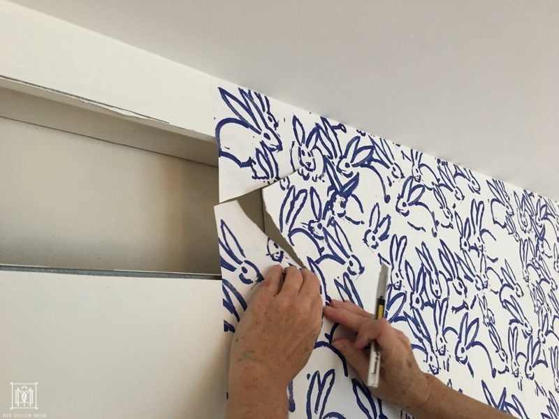 how to cut off excess wallpaper at vents and electrical outlets