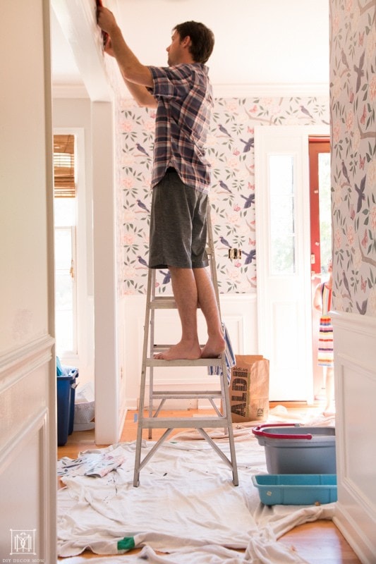 how to hang wallpaper and cut off excess at ceiling