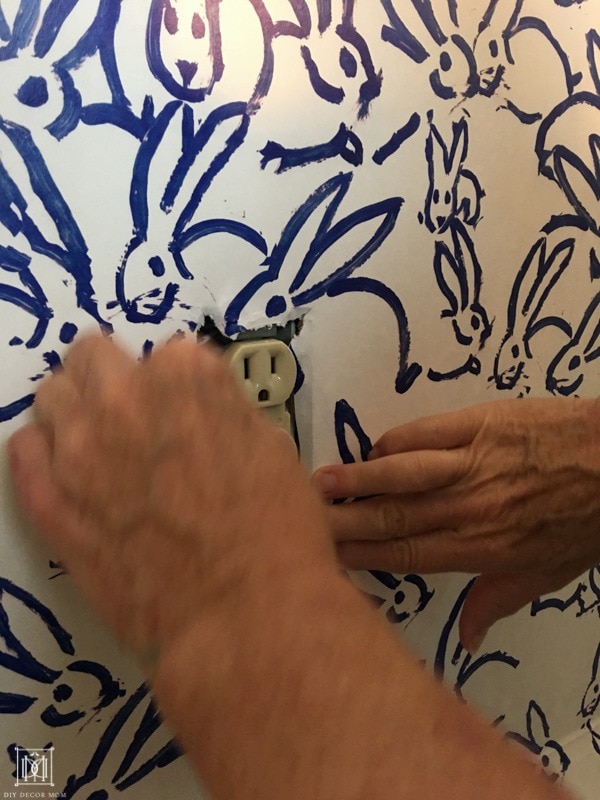 how to hang wallpaper around electrical outlets