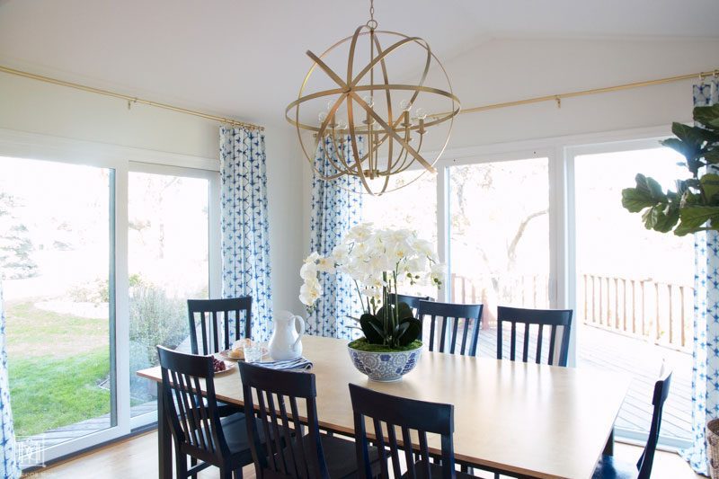 gold chandelier in morning room with eat in kitchen table