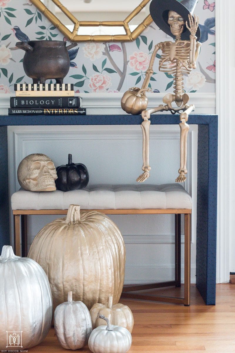 gold halloween pumpkins and skeleton