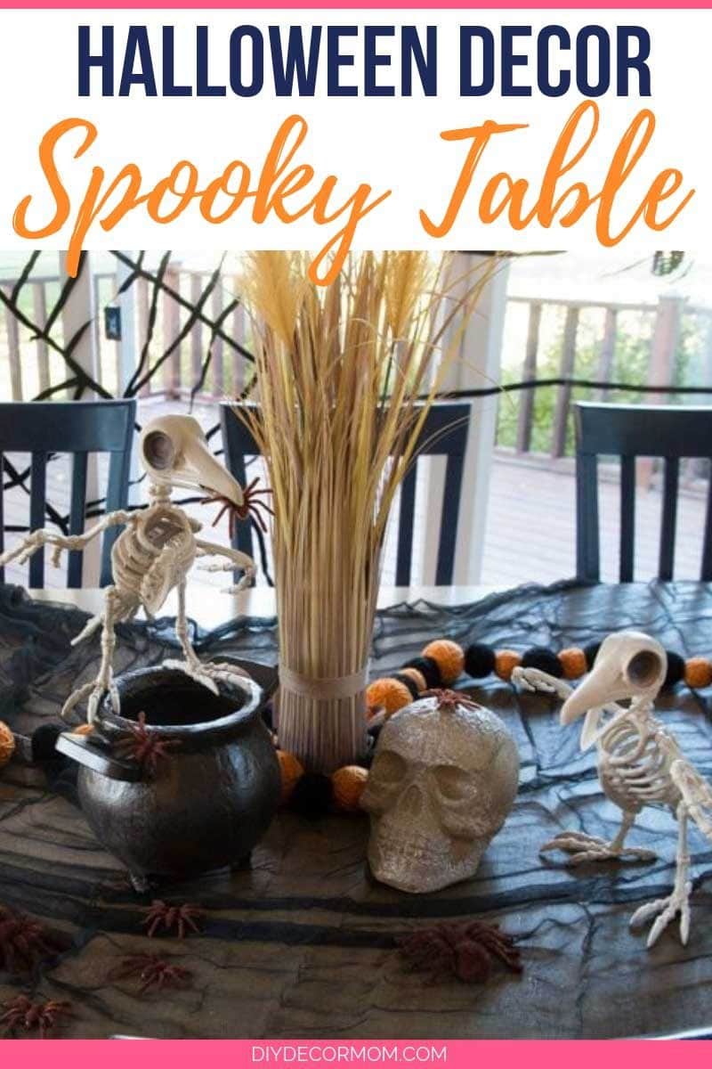 halloween table decor ideas with black tablecloth skeleton skull and spiders